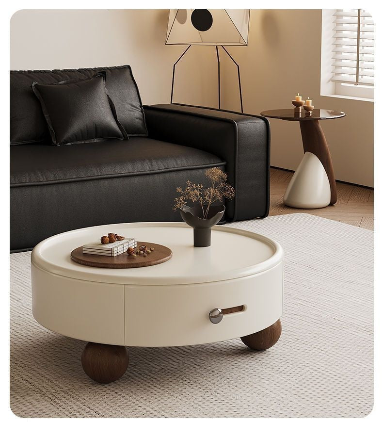 Round coffee table with explosion-proof tempered glass surface and sculptural design
