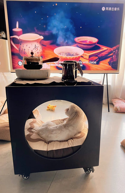Modern sculptural coffee table with circular voids and rubberwood frame in compact living room
